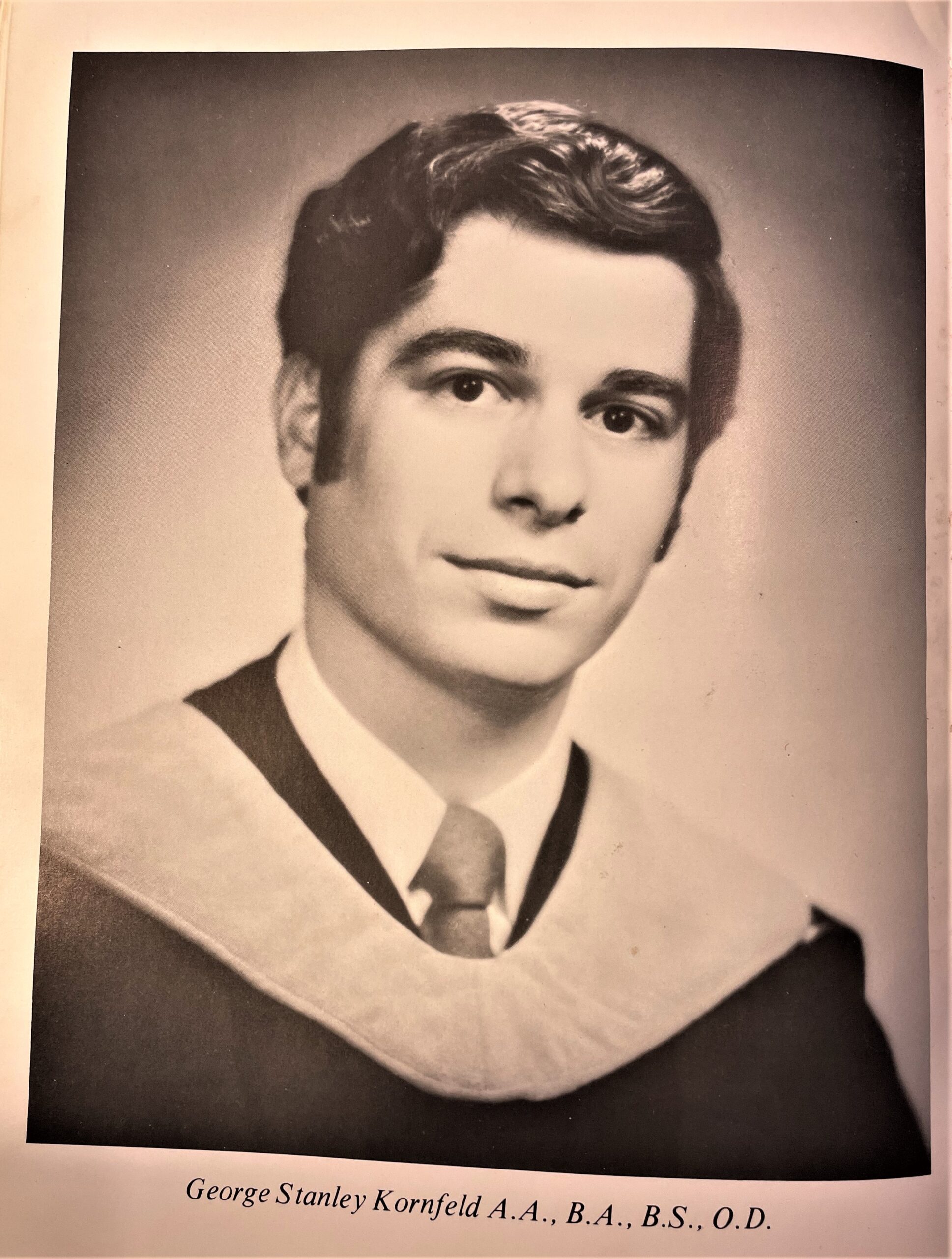 A sepia toned yearbook photo of a young man